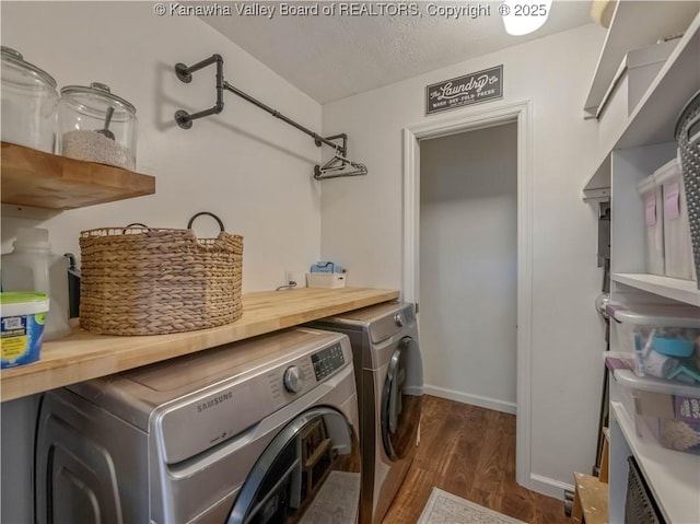 52 Cedar Dr, Hurricane, WV 25526 - laundry room featuring washing machine and clothes dryer, dark wood-style flooring, and a textured ceiling
