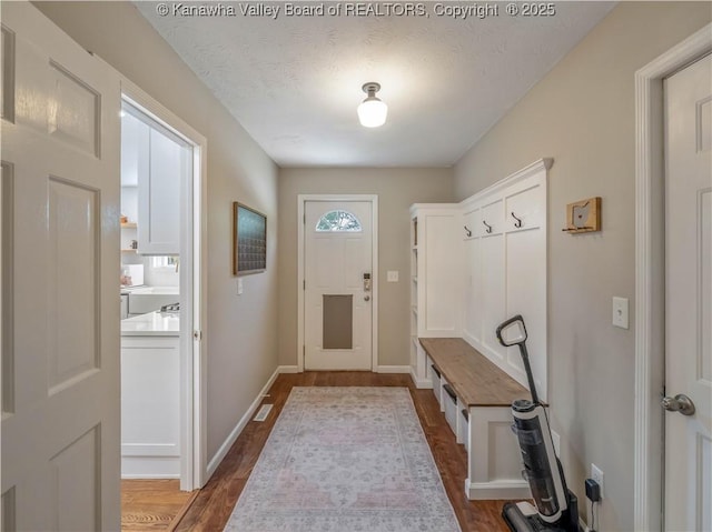 52 Cedar Dr, Hurricane, WV 25526 - mudroom with dark wood-style floors and a textured ceiling