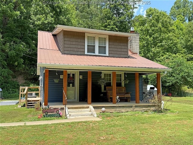 1255 Johns Creek Rd, Milton, WV 25541 - view of front of property featuring a porch, a front yard, a chimney, and a metal roof