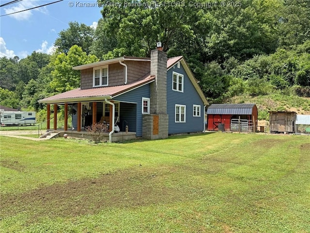 1255 Johns Creek Rd, Milton, WV 25541 - rear view of house with a chimney, a lawn, covered porch, and a metal roof
