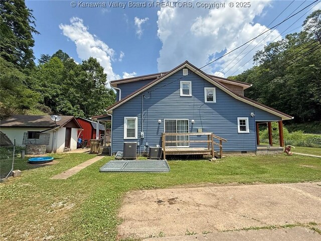 1255 Johns Creek Rd, Milton, WV 25541 - back of property with a yard, a storage shed, and a deck