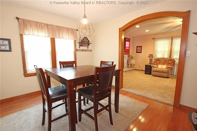 1255 Johns Creek Rd, Milton, WV 25541 - dining space with arched walkways, plenty of natural light, light wood-style floors, and recessed lighting