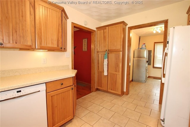 1255 Johns Creek Rd, Milton, WV 25541 - kitchen with white appliances, light countertops, and light tile patterned flooring