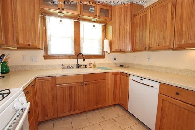 1255 Johns Creek Rd, Milton, WV 25541 - kitchen with white appliances, light tile patterned floors, glass insert cabinets, light countertops, and brown cabinetry