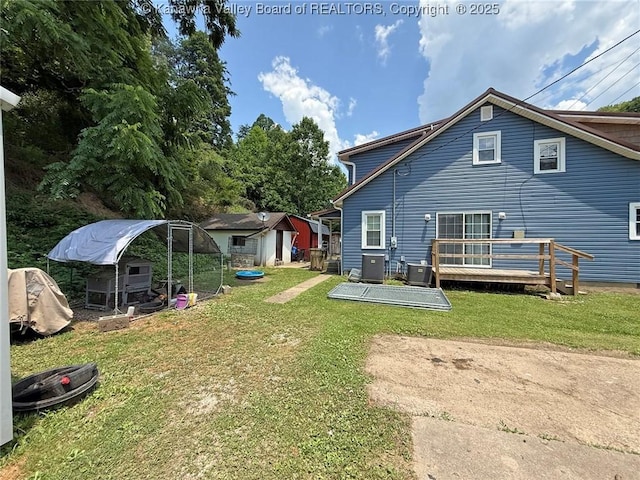 1255 Johns Creek Rd, Milton, WV 25541 - back of house with a yard, an outdoor structure, exterior structure, and a wooden deck