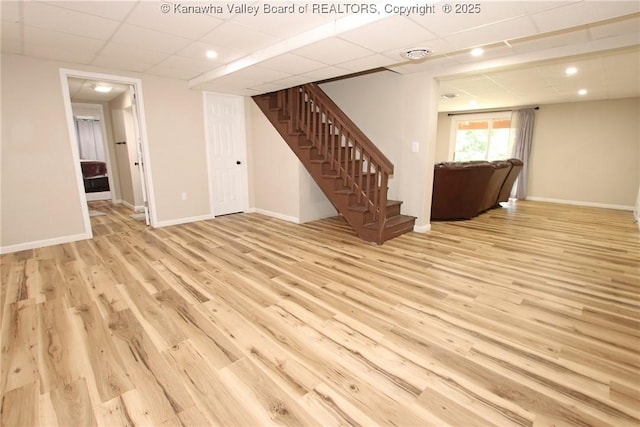 1412 Wilkie Dr, Charleston, WV 25314 - unfurnished living room featuring stairs, wood finished floors, and a drop ceiling