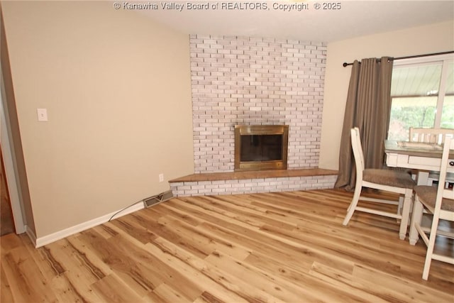 1412 Wilkie Dr, Charleston, WV 25314 - unfurnished dining area featuring a fireplace and wood finished floors