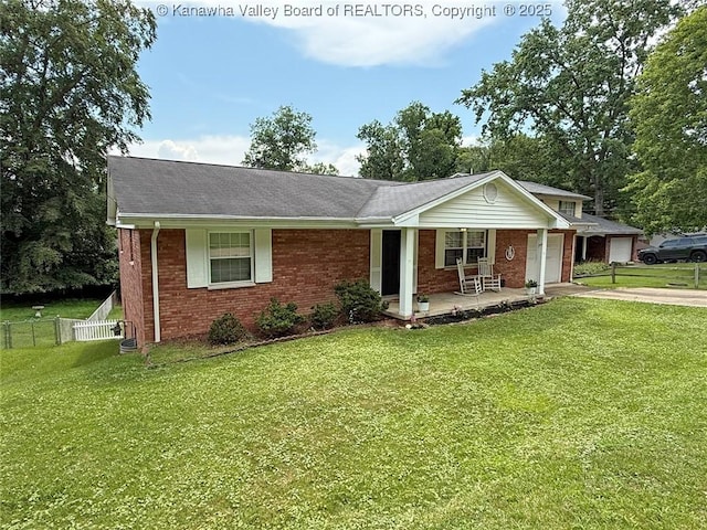 1412 Wilkie Dr, Charleston, WV 25314 - single story home with brick siding, a porch, concrete driveway, an attached garage, and roof with shingles