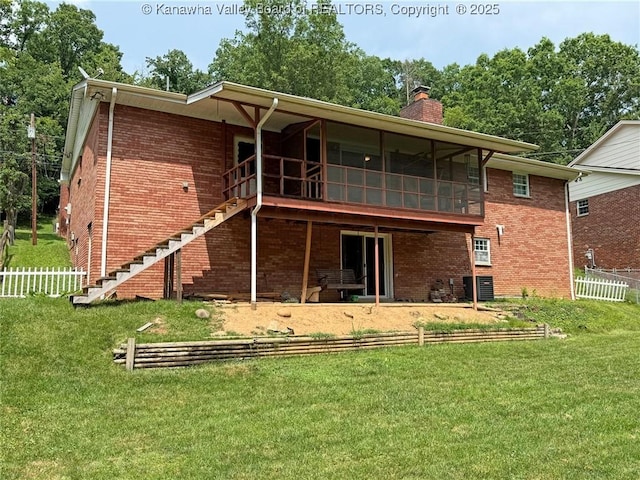 1412 Wilkie Dr, Charleston, WV 25314 - back of house with brick siding, a chimney, stairs, and a sunroom