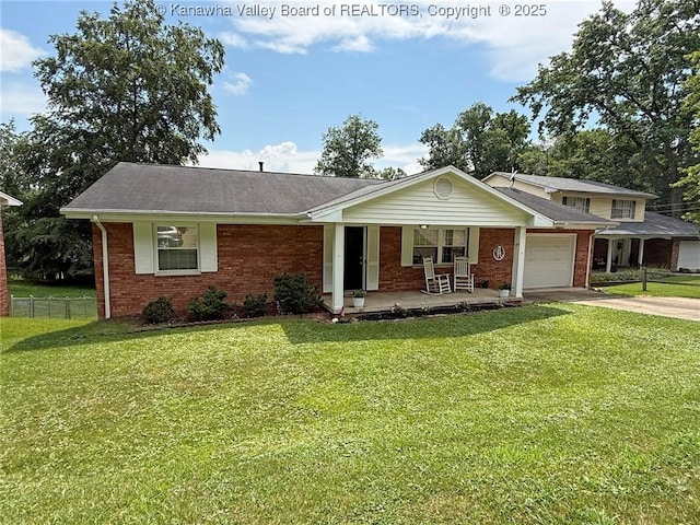 1412 Wilkie Dr, Charleston, WV 25314 - view of front of home with a porch, brick siding, an attached garage, and concrete driveway