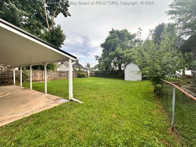 191 N Park Dr, Point Pleasant, WV 25550 - fenced backyard featuring a storage unit and a patio area