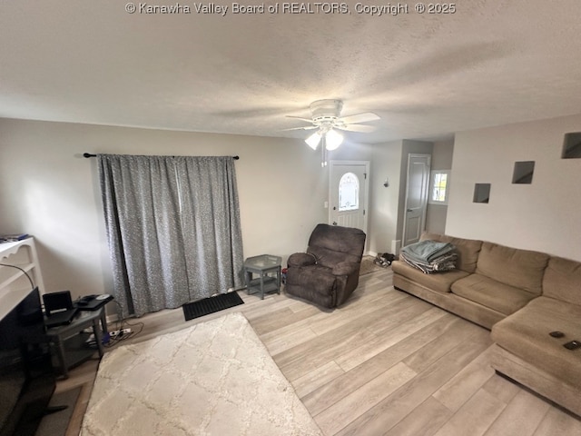 191 N Park Dr, Point Pleasant, WV 25550 - living area with wood finished floors, ceiling fan, and a textured ceiling