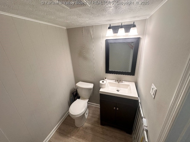 191 N Park Dr, Point Pleasant, WV 25550 - half bath with vanity, wood finished floors, a textured ceiling, and ornamental molding