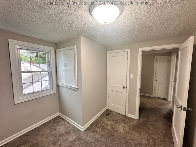 191 N Park Dr, Point Pleasant, WV 25550 - hall featuring dark carpet and a textured ceiling