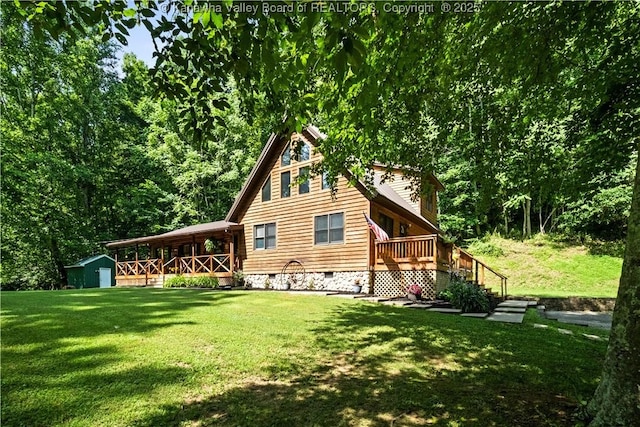180 Tryphenia Rd, Hurricane, WV 25526 - back of house with a shed, a lawn, a deck, and crawl space