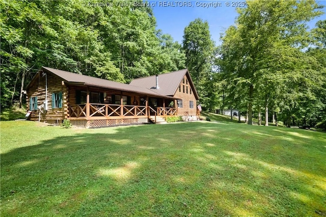 180 Tryphenia Rd, Hurricane, WV 25526 - back of house with a porch, a lawn, log exterior, and a metal roof
