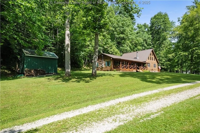 180 Tryphenia Rd, Hurricane, WV 25526 - view of green lawn featuring driveway, covered porch, and a storage shed
