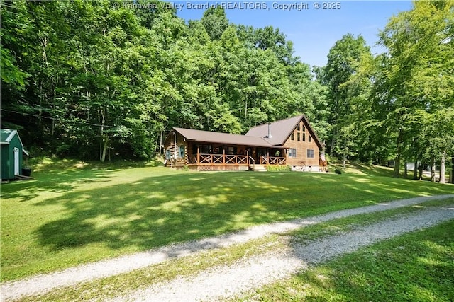 180 Tryphenia Rd, Hurricane, WV 25526 - view of front of home featuring a porch, a front lawn, and a wooded view