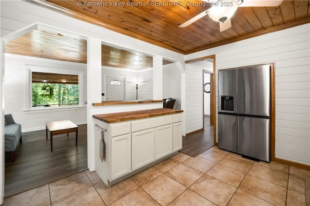 180 Tryphenia Rd, Hurricane, WV 25526 - kitchen featuring stainless steel refrigerator with ice dispenser, wooden ceiling, butcher block countertops, light tile patterned floors, and ceiling fan