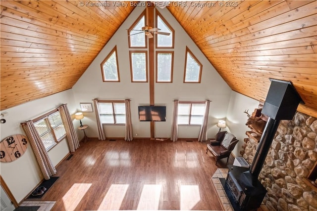 180 Tryphenia Rd, Hurricane, WV 25526 - additional living space with a wood stove, a ceiling fan, plenty of natural light, wood finished floors, and wood ceiling