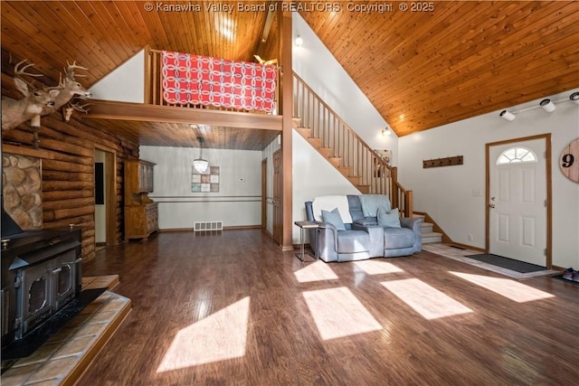 180 Tryphenia Rd, Hurricane, WV 25526 - unfurnished living room with wood ceiling, high vaulted ceiling, stairs, a wood stove, and wood finished floors