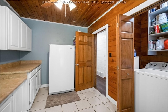 180 Tryphenia Rd, Hurricane, WV 25526 - laundry area with washer / dryer, cabinet space, wooden ceiling, ceiling fan, and light tile patterned floors
