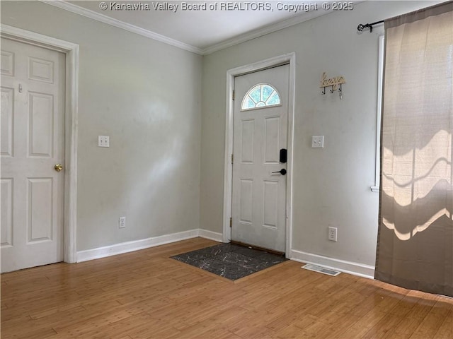 1206 Central Ave, Saint Albans, WV 25177 - entryway featuring light wood finished floors and ornamental molding