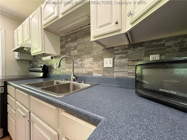1206 Central Ave, Saint Albans, WV 25177 - kitchen featuring electric range, dark countertops, under cabinet range hood, backsplash, and white cabinetry