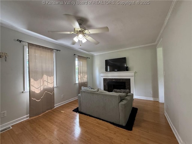 1206 Central Ave, Saint Albans, WV 25177 - living room featuring a fireplace, crown molding, ceiling fan, and wood finished floors