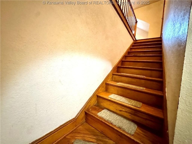 17739 US Route 60, Culloden, WV 25510 - staircase featuring a textured wall and baseboards