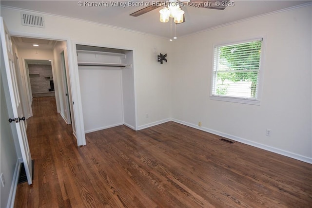 1516 Fenton Cir, Nitro, WV 25143 - unfurnished bedroom featuring crown molding, dark wood-style floors, a closet, attic access, and ceiling fan