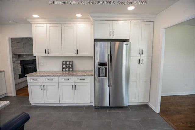 1516 Fenton Cir, Nitro, WV 25143 - kitchen with high end refrigerator, white cabinetry, light stone counters, dark tile patterned flooring, and recessed lighting