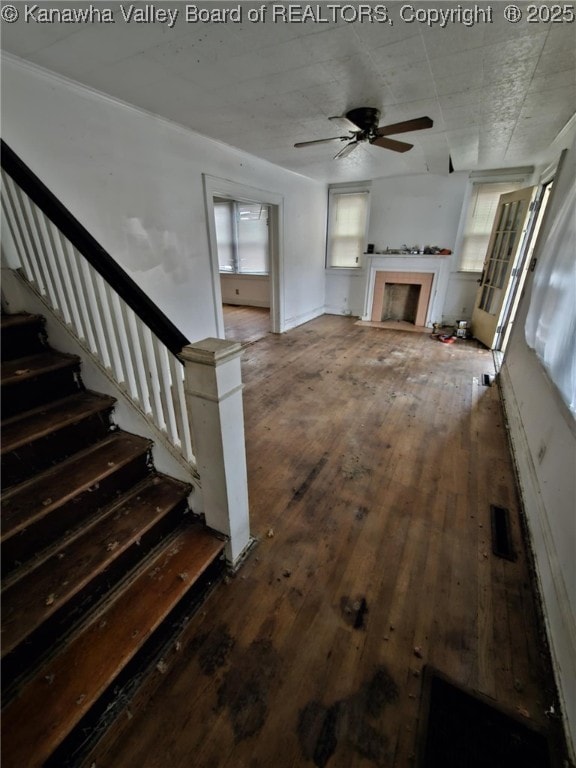 521 Roane St, Charleston, WV 25302 - unfurnished living room with a ceiling fan, hardwood / wood-style floors, stairs, and a fireplace