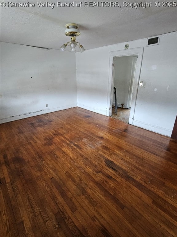 521 Roane St, Charleston, WV 25302 - empty room featuring hardwood / wood-style flooring and a textured ceiling