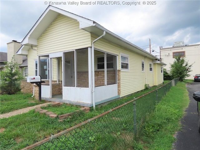 4808 Kentucky St, South Charleston, WV 25309 - view of home's exterior featuring a sunroom