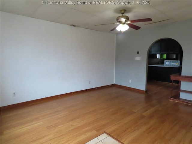 4808 Kentucky St, South Charleston, WV 25309 - spare room with a ceiling fan, arched walkways, and wood finished floors