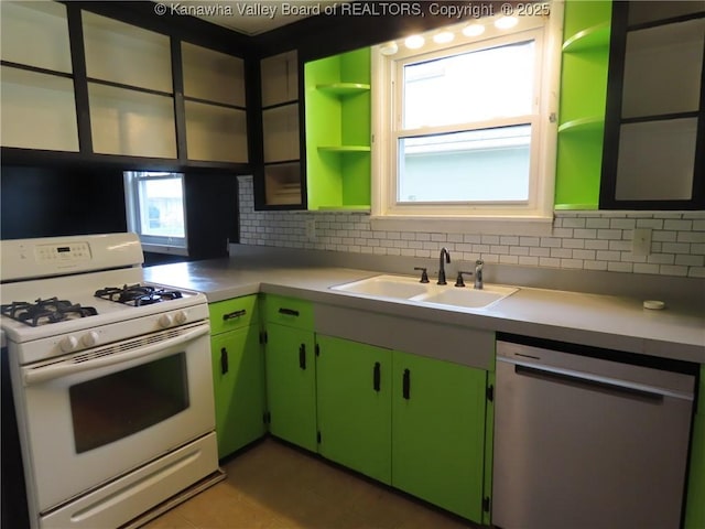 4808 Kentucky St, South Charleston, WV 25309 - kitchen featuring white gas range, stainless steel dishwasher, open shelves, backsplash, and light countertops