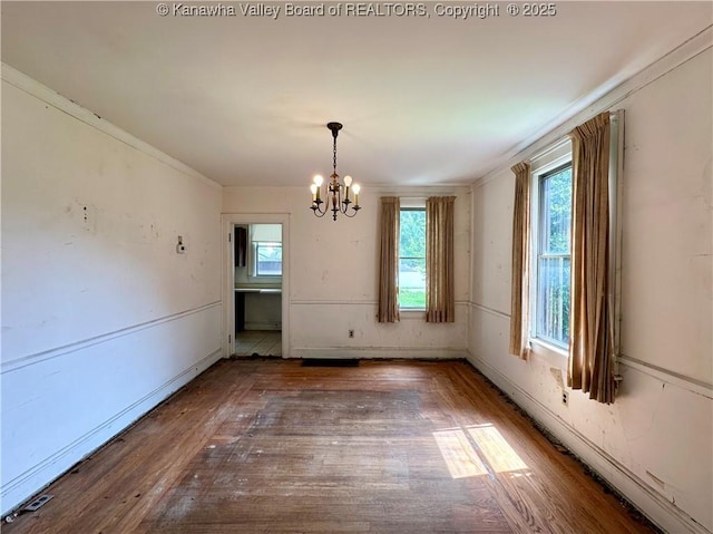 5430 Virginia Ave SE, Charleston, WV 25304 - unfurnished dining area with a chandelier, wood finished floors, and crown molding