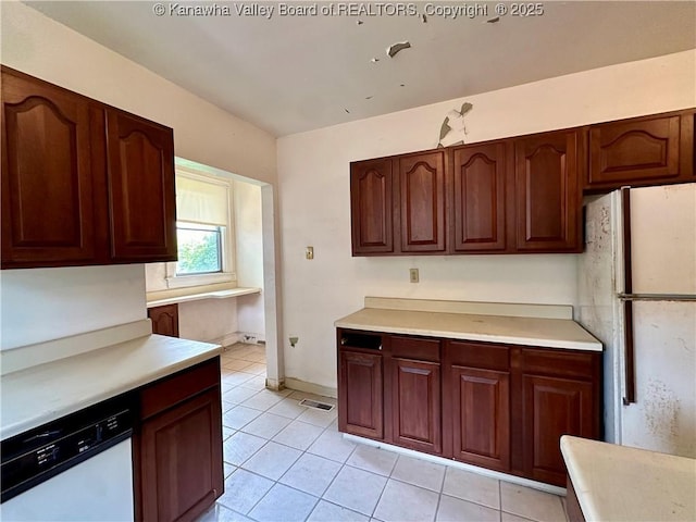 5430 Virginia Ave SE, Charleston, WV 25304 - kitchen featuring white appliances, light tile patterned flooring, and light countertops