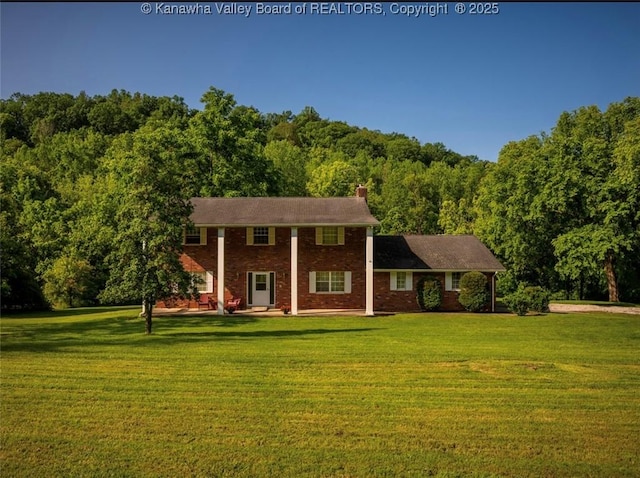1846 Scott Depot Rd, Scott Depot, WV 25560 - neoclassical / greek revival house featuring a front yard, a view of trees, and brick siding