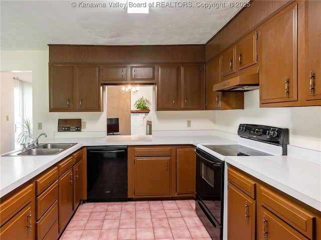 1846 Scott Depot Rd, Scott Depot, WV 25560 - kitchen with black appliances, under cabinet range hood, light countertops, and light tile patterned floors