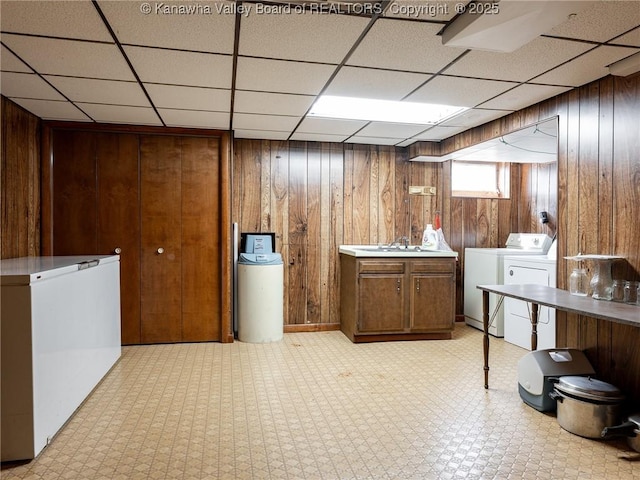 1846 Scott Depot Rd, Scott Depot, WV 25560 - washroom with wooden walls, light flooring, cabinet space, and washing machine and dryer
