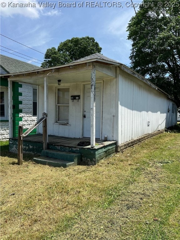 7001/2 Buffington St, Huntington, WV 25702 - property entrance with a porch and a lawn