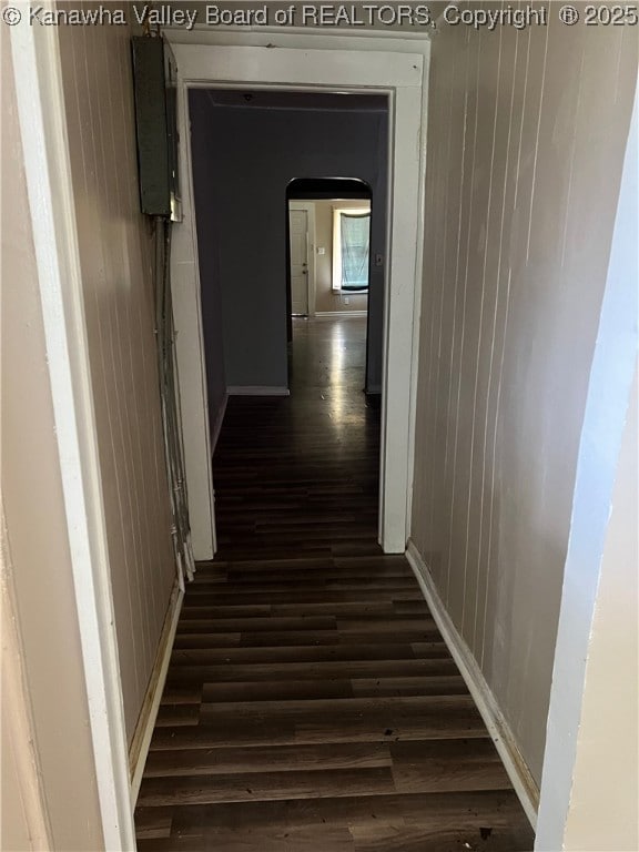 7001/2 Buffington St, Huntington, WV 25702 - hallway with dark wood finished floors, wood walls, and arched walkways