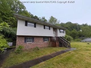 873 Woods Dr, Saint Albans, WV 25177 - view of front of house featuring a front lawn