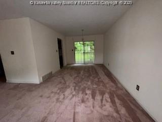 873 Woods Dr, Saint Albans, WV 25177 - unfurnished living room with carpet flooring
