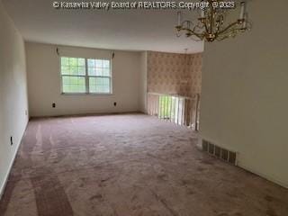 873 Woods Dr, Saint Albans, WV 25177 - unfurnished room featuring a chandelier and carpet flooring