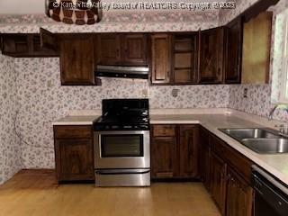 873 Woods Dr, Saint Albans, WV 25177 - kitchen featuring stainless steel range oven, black dishwasher, under cabinet range hood, wallpapered walls, and dark brown cabinets