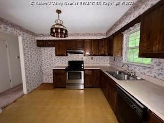 873 Woods Dr, Saint Albans, WV 25177 - kitchen with stainless steel stove, dishwasher, under cabinet range hood, dark brown cabinetry, and wallpapered walls