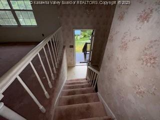 873 Woods Dr, Saint Albans, WV 25177 - stairs featuring healthy amount of natural light and wallpapered walls